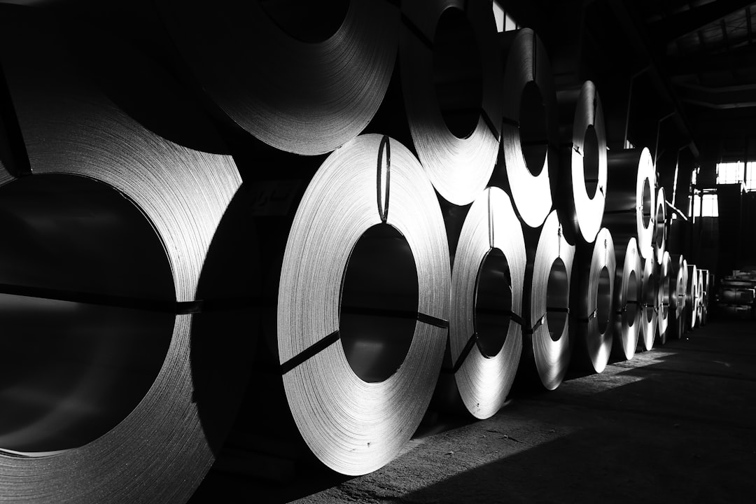 Large steel coils stored in an industrial warehouse